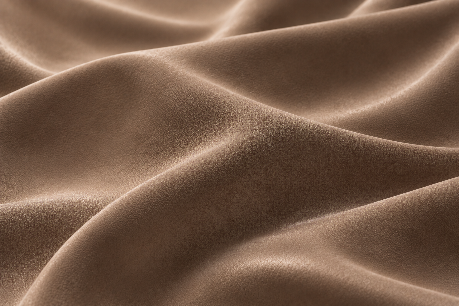 Softly folded taupe material with sculptural waves